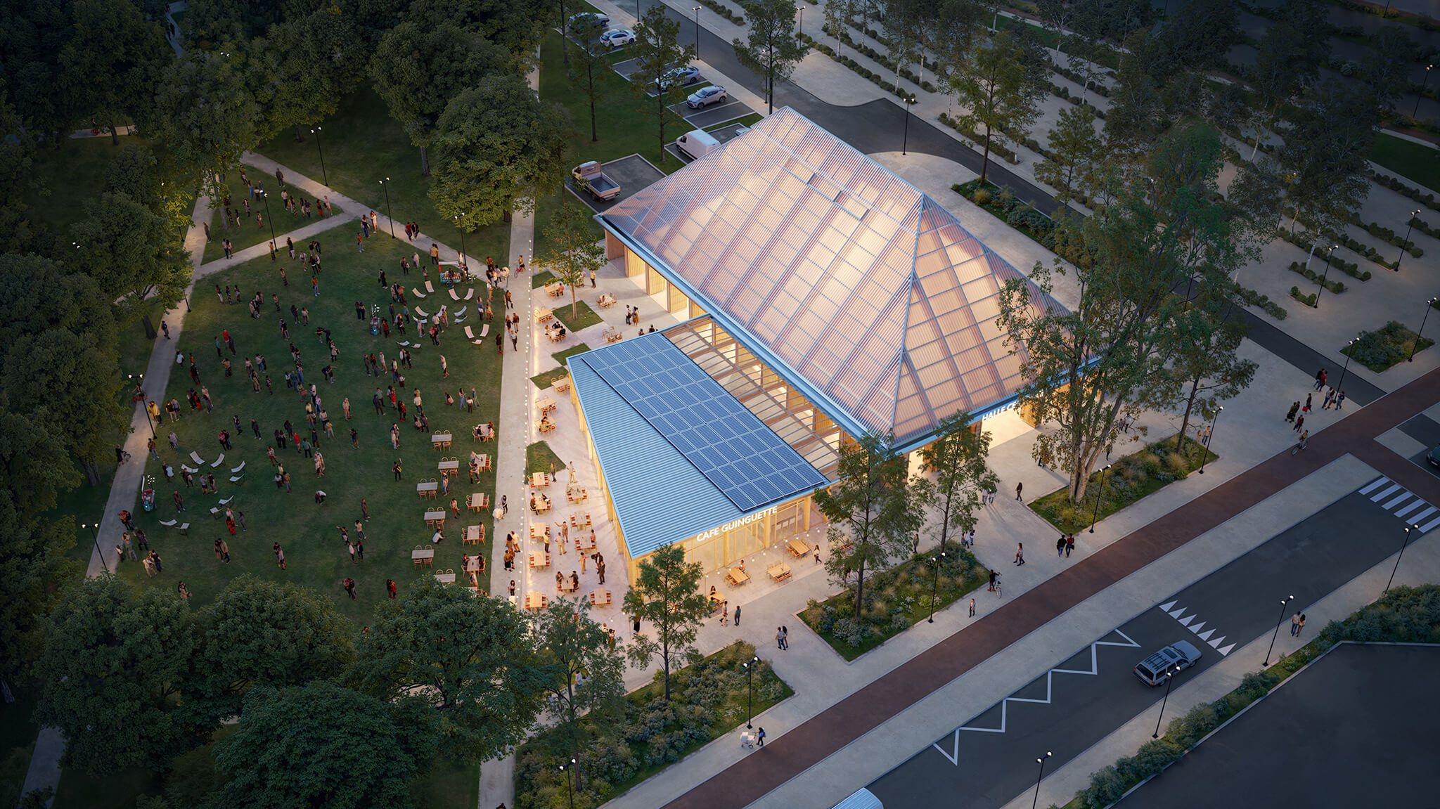 Vu aérienne de la halle de marché de Carrière-sous-Poissy en soirée avec des habitants qui profitent de la guinguette.